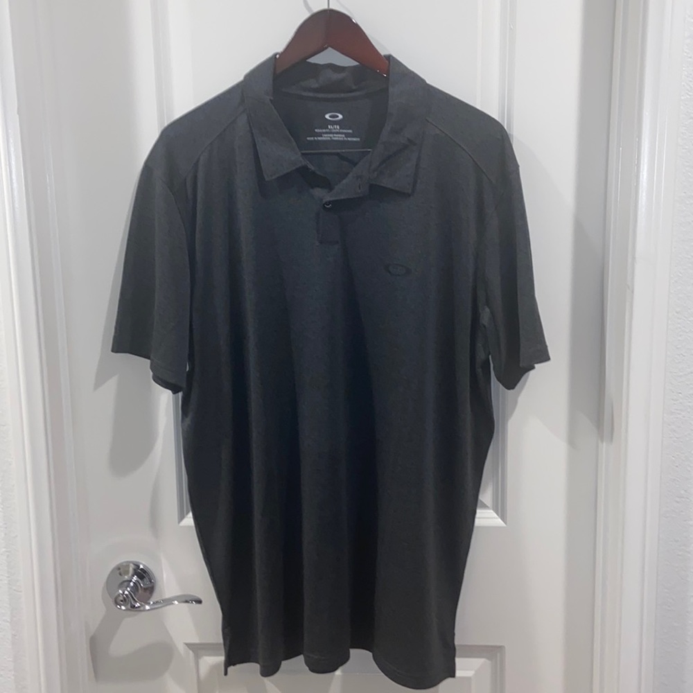 Oakley- Dark Grey, semi black colored, 2 button collared Shirt.